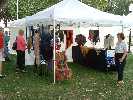Fair goers admire shawls